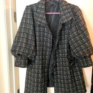 Chic jacket. Single breasted fitted coat.